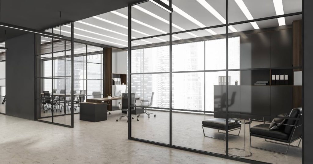 3D render of an office with bold, glass wall partitions made of an aluminum frame