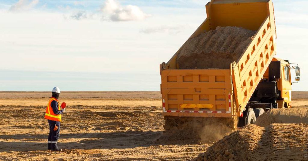 dump truck hauling sand